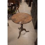 A 19th Century oak pedestal table having circular top , turned column and triple splay legs (with