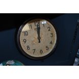 An early to mid 20th-century Smiths Sectric bakelite wall clock, featuring a yellowed dial face with