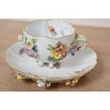 A late 19th-century Meissen porcelain demitasse cup and saucer duo, featuring delicate flower