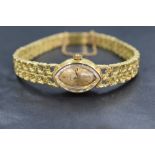 A lady's 1960/70's 18ct gold Omega manual movement cocktail watch having a baton numeral dial to