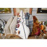A pair of At Home In The Country rectangular cushions featuring countryside animals and birds, an