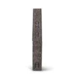 A JAPANESE CARVED STONE POST, MEIJI PERIOD in two sections of square tapering from, each with carved