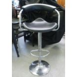 A modern chromium framed, black faux hide upholstered bar stool
