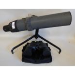 A Greenkat 22x57 spotting telescope, on a folding tripod base; and a pair of Olympus 8-16 x40 Zoom