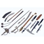 A collection of reproduction swords and other weaponry