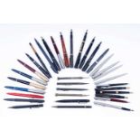 A collection of fountain and ball point pens; and a silver propelling pencil