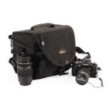 An Olympus OM-D E-M5 camera outfit and accessories