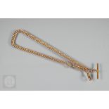 A 9ct rose gold double Albert watch chain with bar, swivel and oversized bolt ring, 38 cm long (
