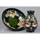 A Moorcroft 'Passion Flower' fruit bowl, designed by Rachel Bishop 1997, 26cm diameter, to/w a '