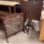 A 19th century mahogany tripod table with a rectangular top and barley twist column on a tripod