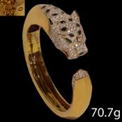 VERY FINE ONYX AND DIAMOND PANTHER BANGLE, IN THE STYLE OF CARTIER