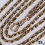 A VICTORIAN GOLD GUARD CHAIN
