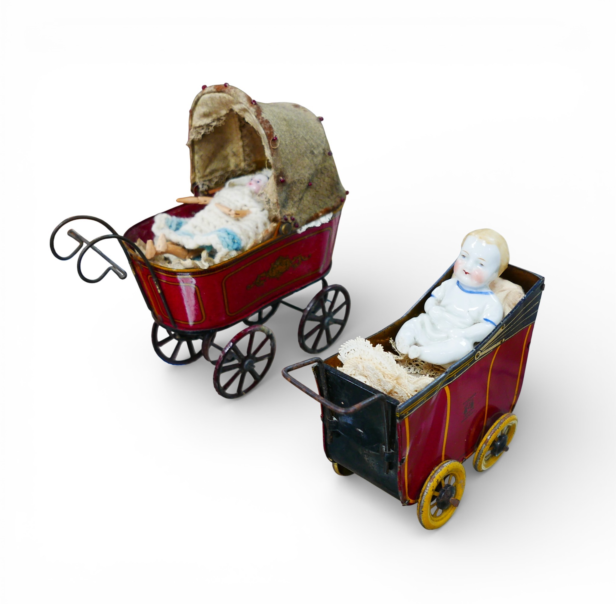 Two early 20th century Wells tinplate toy prams, the largest with a ...