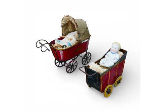 Two early 20th century Wells tinplate toy prams, the largest with a ...