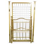 A brass single bed frame, with side rails and sprung base. 98 by 195 by 130cm high.