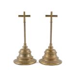 A PAIR OF VICTORIAN WEIGHTED BRASS DOOR STOPS OR DOOR PORTERS (2)