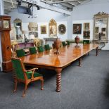 GILLOW; A 19TH CENTURY POLLARD OAK DOUBLE ACTION EXTENDING DINING TABLE