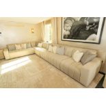 A LARGE RIBBED CREAM UPHOLSTERED THREE SECTION CORNER SOFA (2)