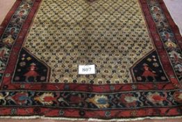 A North West Persian Bidjar rug with a central medallion depicting stylised animals on a lattice
