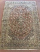 A good Persian Ardakani rug. Central motif on muted pinks and browns. 205 x 143cms (approx).