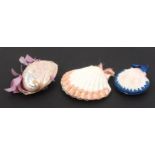 Three needle books formed from sea shells, comprising a scallop form example with stitched pink