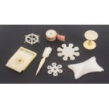 A mixed lot, sewing, mother of pearl, comprising a fine thread winder pierced and engraved with
