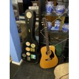 An Ibanez V30 acoustic guitar, with hard case