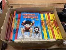 A box of The Dandy, The Beano, and Oor Wullie annuals, from the 1980s onwards