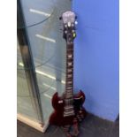 An Epiphone electric guitar, with soft case