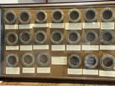 Glass shadow box containing 20 original beer barre