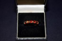 9ct Gold ring set with 5 garnets Weight 2.2g Size
