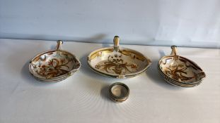 Set of three handled oval studio pottery bowls and a small dish, foliate decorated, signed