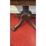 A Victorian mahogany fold-over tea table, the rectangular top with rounded corners hinging to form a