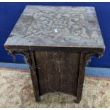 An early 20th century oak square top table, in the Liberty style with a scroll carved top