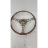 A Beswick ceramic dish fashioned as a steering wheel advertising Dunlop Sport made for Les Leston