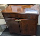 An early 20th century mahogany cabinet having a single drawer above two doors, 95h x 98w Location: