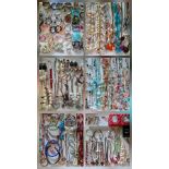 A large quantity of modern costume jewellery to include bangles, bead bracelets and necklaces,