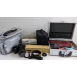 A Nikon D3100 digital camera with accessories to include a Tamran macro lens Location: If there is