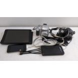 Two digital cameras, one Yamaha, an iPad mini, an iPhone 4, a power bank and cables Location: If
