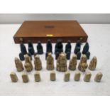 A composition Lewis Chess Set, in original wooden box. Location: upstairs If there is no condition