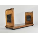 A Late 19th Century Liberty & Co. Style Bookstand with Decorative Ebonised Mashrabiya Panels,