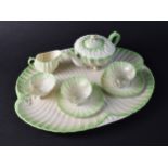 A Belleek Porcelain Cabaret Shell Shaped Tea Set Comprising Tray, Teapot (Teapot Finial Glued),