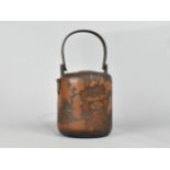 A Japanese Meiji Period Carved Bamboo Teapot Decorated in Relief with Leaves, Buds and Bird, Loop