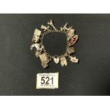 A STERLING SILVER CHARM BRACELET, HEART-SHAPED FASTENING STAMPED 'SILVER', WITH 14 CHARMS,