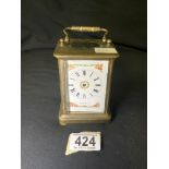 A FRENCH BRASS CARRIAGE CLOCK, FLORAL PAINTED WHITE ENAMEL DIAL INSCRIBED 'RUSSELLS PARIS', HEIGHT