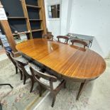 A THREE-LEAF MAHOGANY EXTENDING DINING TABLE WITH SIX MATCHING CHAIRS, 110 X 229CM WHEN FULLY