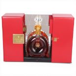 A Remy Martin Louis XIII Grande Champagne Cognac bottle in gift box, with mirror back display