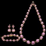An Antique gilt-metal amethyst paste demi-parure, comprising graduated Riviere necklace 44cm, line