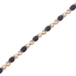A 9ct gold sapphire and diamond tennis line bracelet, set with oval-cut sapphires and single-cut