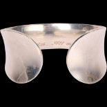 A modernist sterling silver cuff bangle, band width 30.6mm, internal circumference approx 16cm, 51.